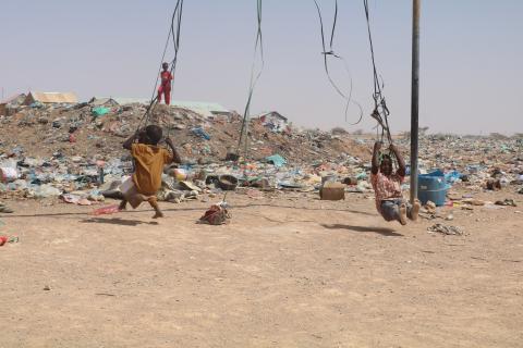 Children playing in a dumping site near their home in IDP camp in Garowe, Puntland, Somalia. [Photo: Abdi Omar Bile]